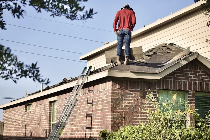 Professional roofer working on a residential roof in Lehi City Plaza